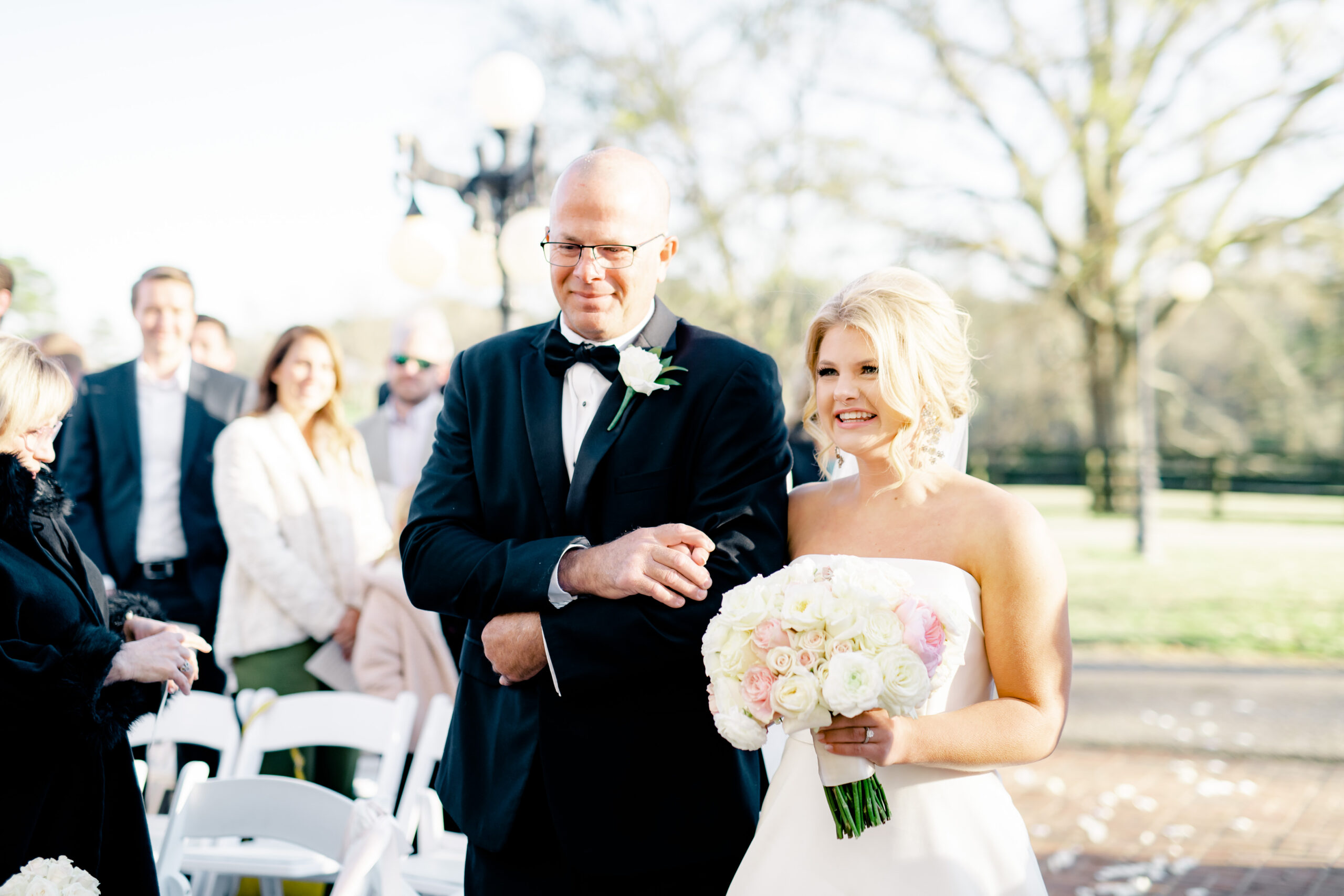 The father of the bride walks his daughter down the aisle for this spring wedding at Marsgate wedding venue.