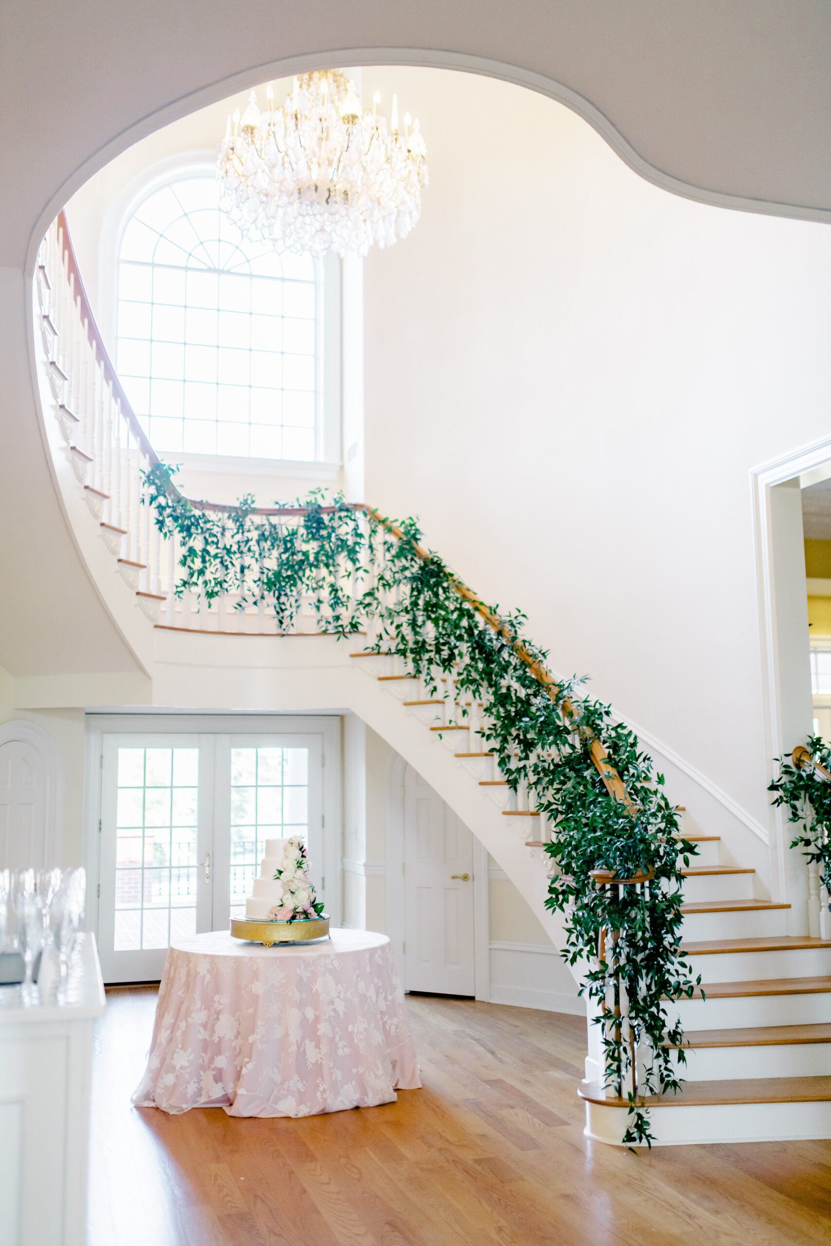 The wedding cake is set under the chandelier at Marsgate in Eclectic, Alabama.