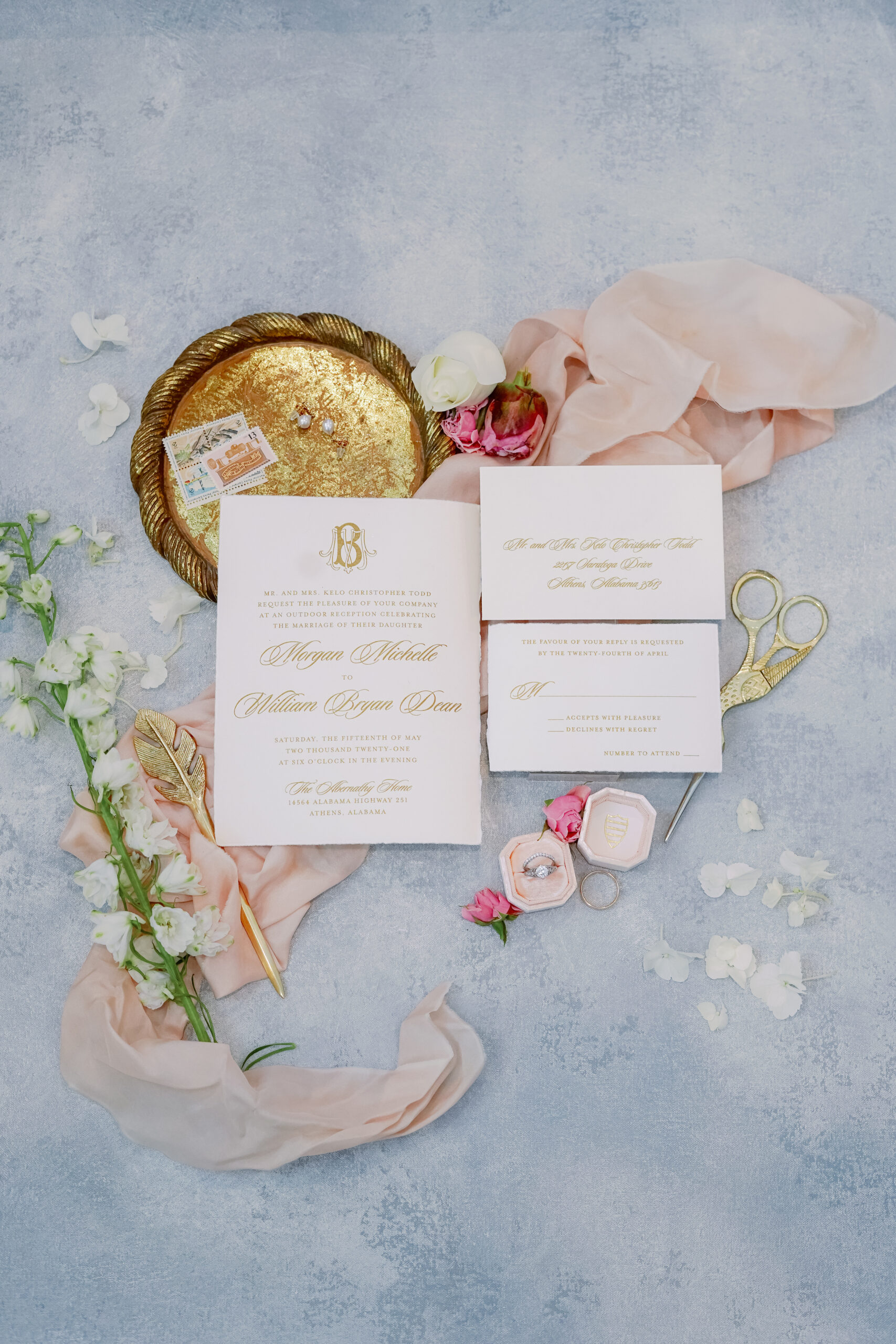 The Southern wedding invitations are styled in a lay flat by Carla Lawrence Photography.