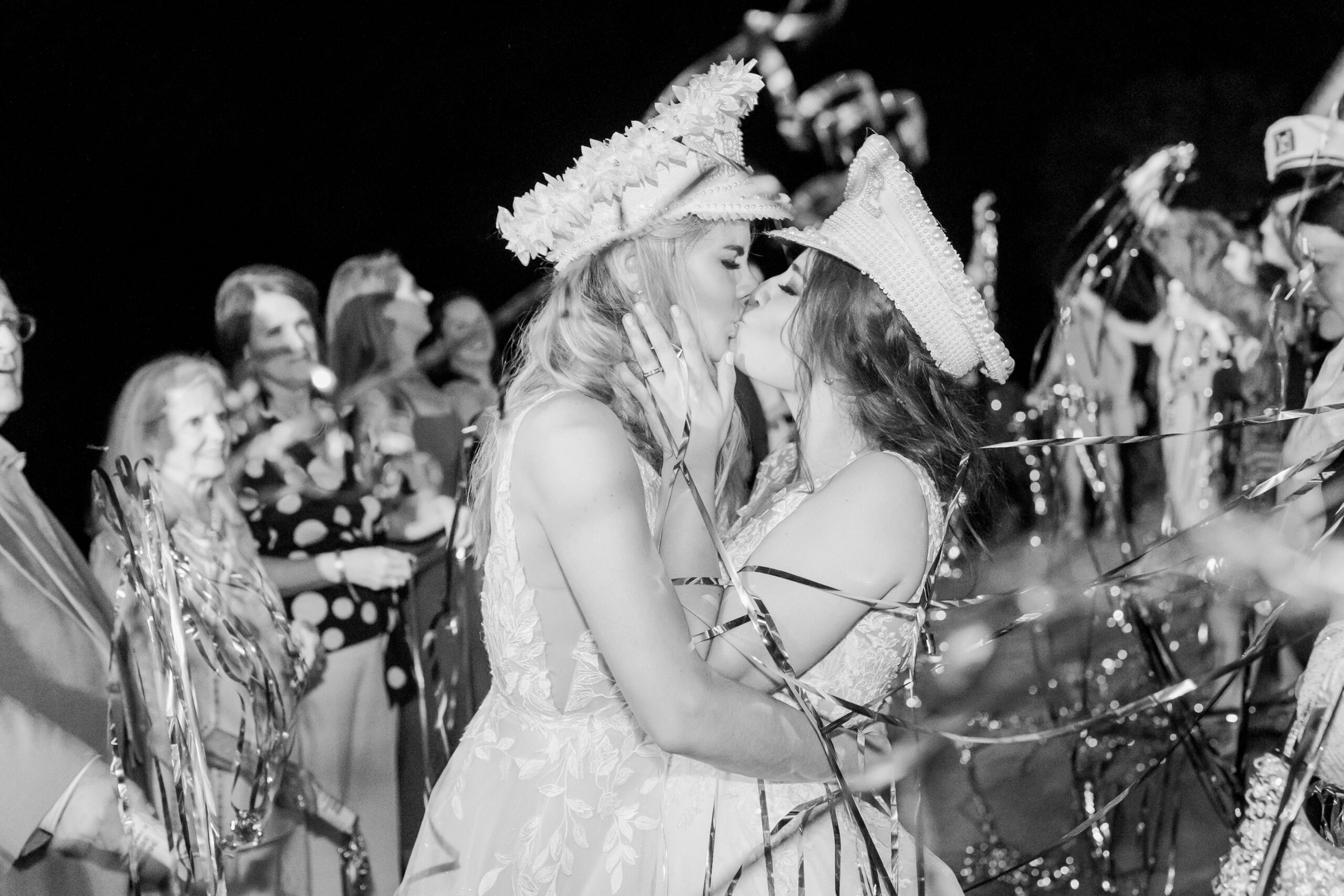 The brides share a kiss after their Southern wedding reception at The Sonnet House.