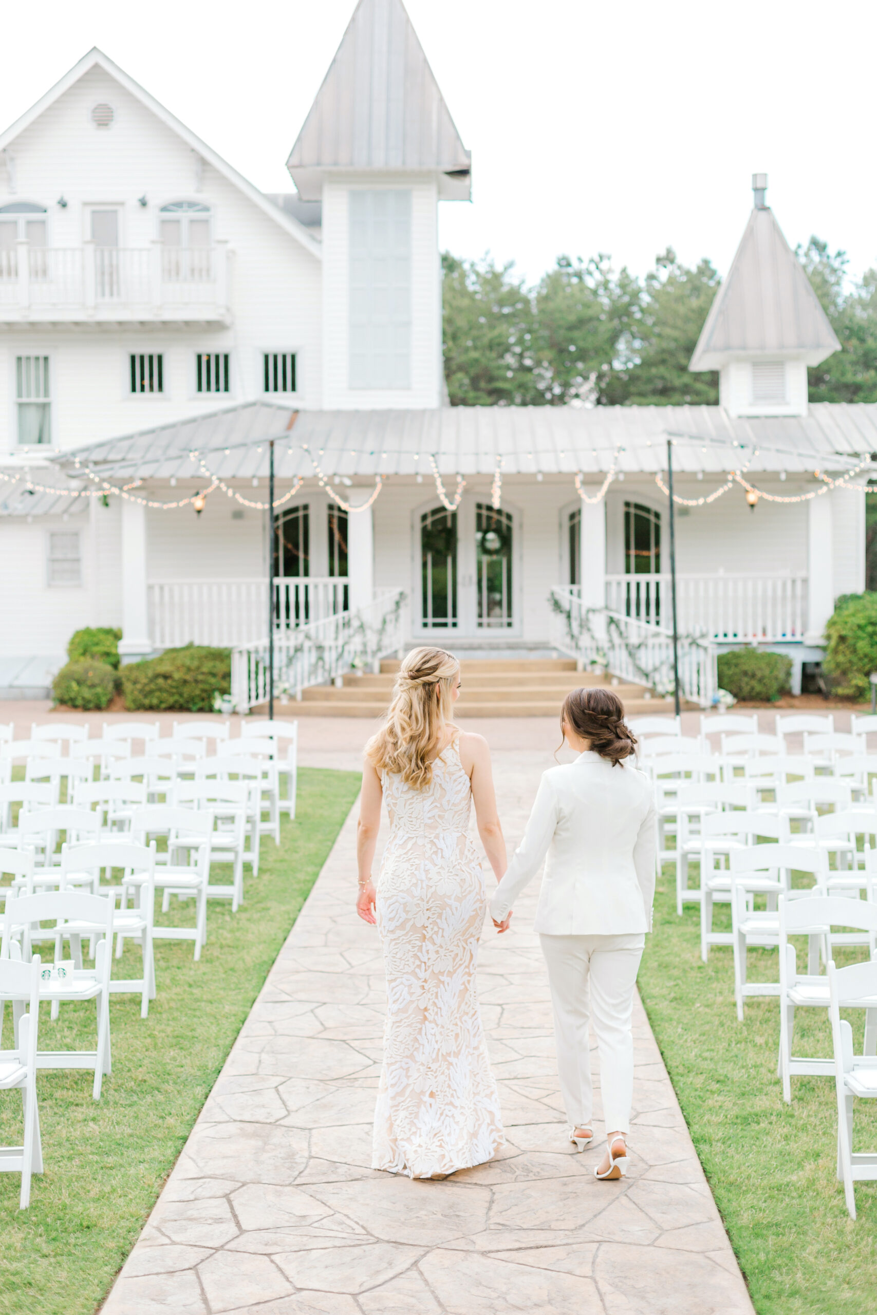 The brides walk together at The Sonnet House.