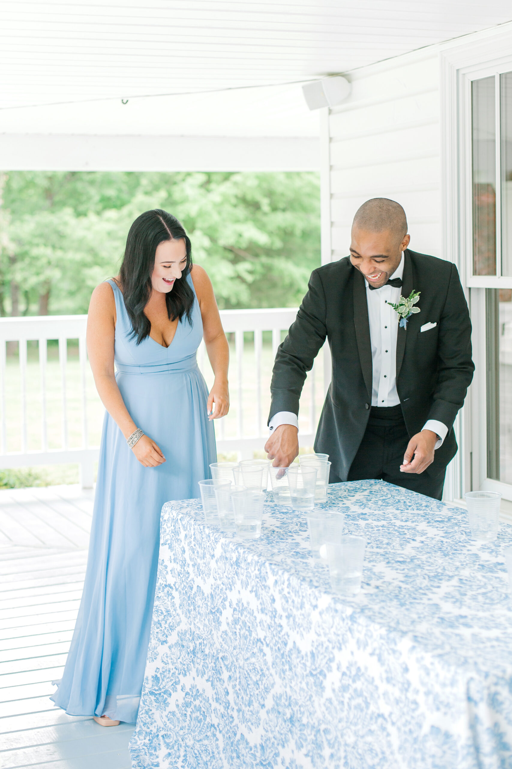 Wedding guests play beer pong on the patio at The Sonnet House.