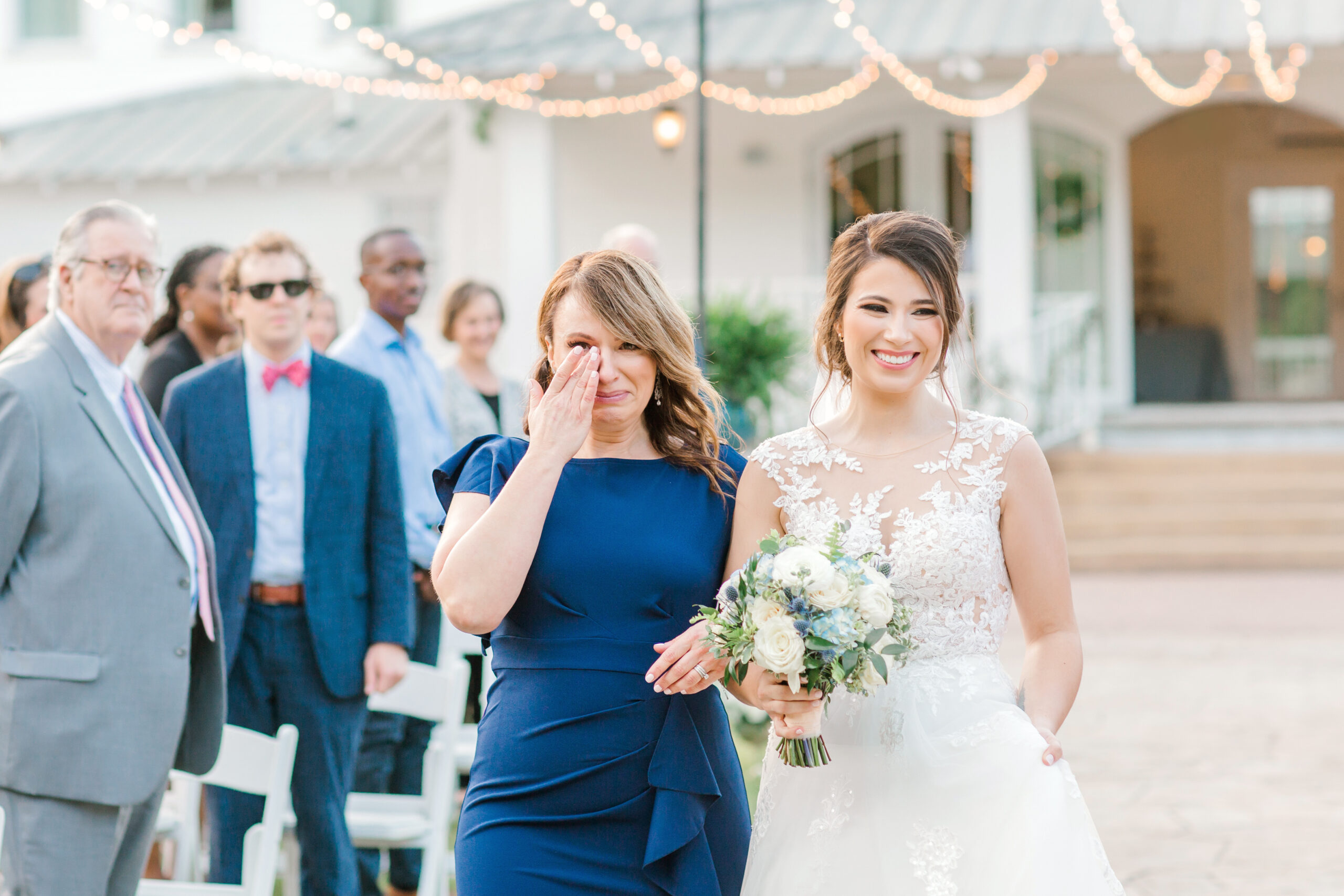 The mother of the bride walks her daughter down the aisle for the Southern wedding at The Sonnet House.