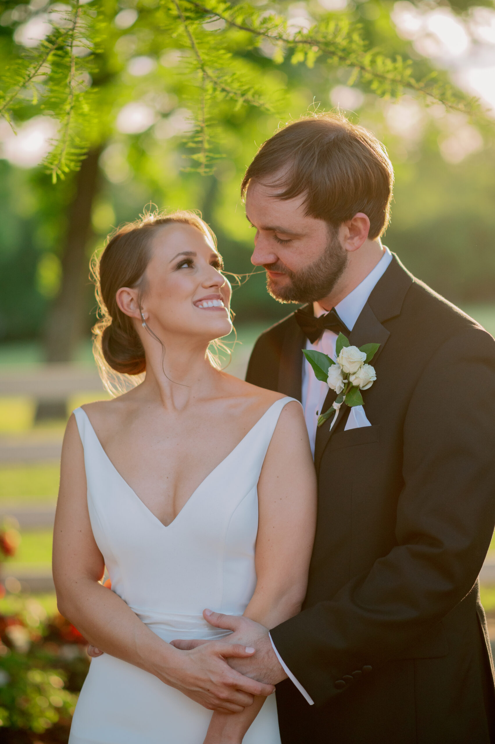 The bride and groom embrace before their Alabama wedding ceremony.