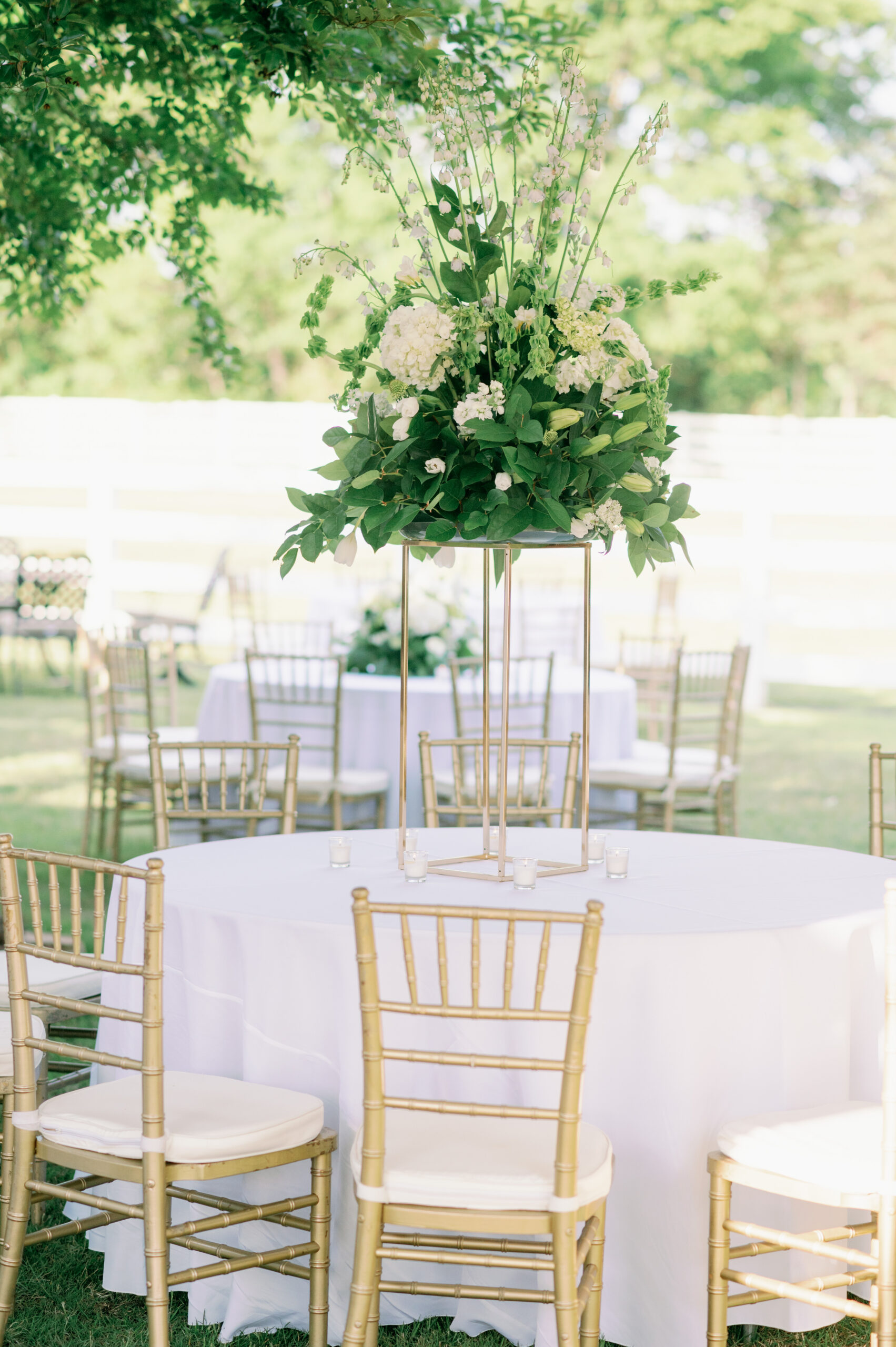 A floral centerpiece is placed on the table during the spring wedding reception in Alabama.