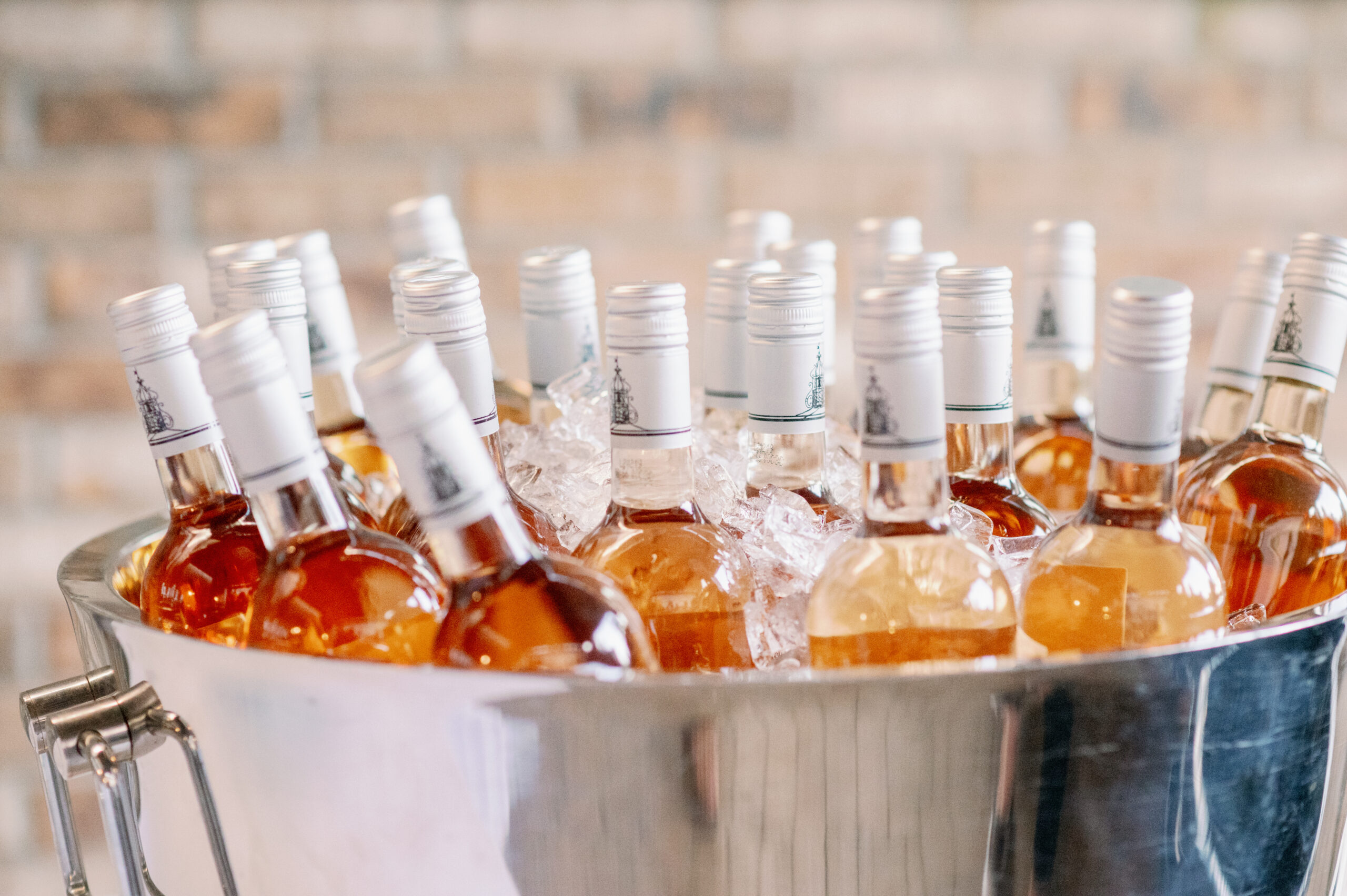 Bottles of rose wine are chilled for the Alabama wedding reception.