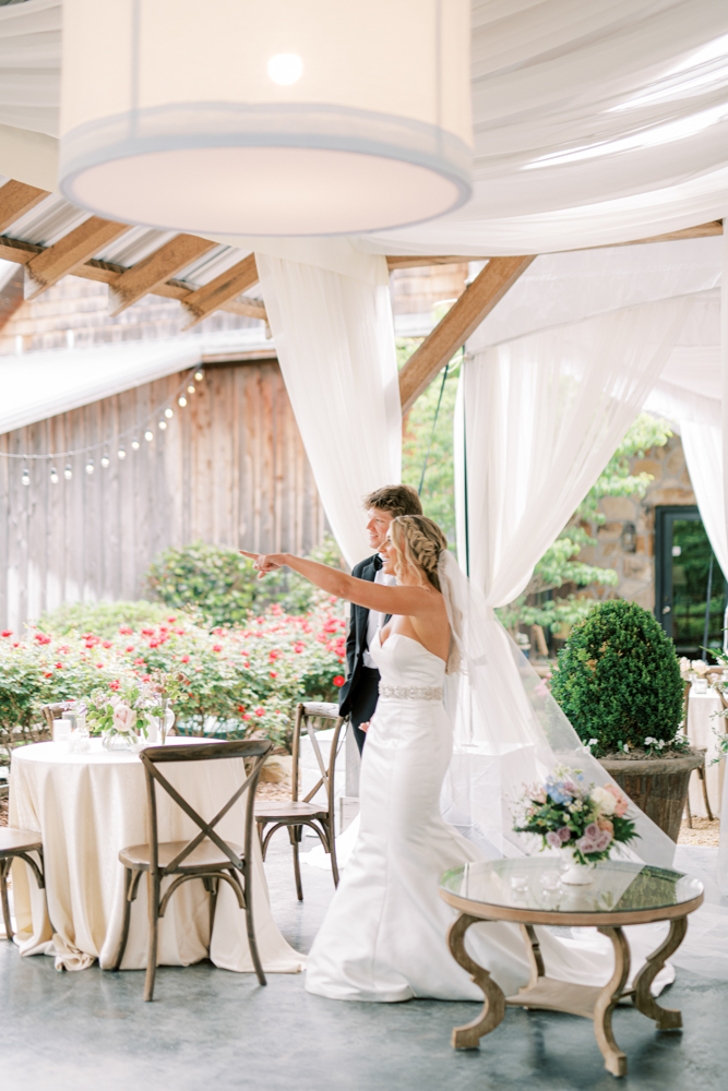 The bride and groom see their wedding reception tent for the first time at Otter Creek Farmstead.