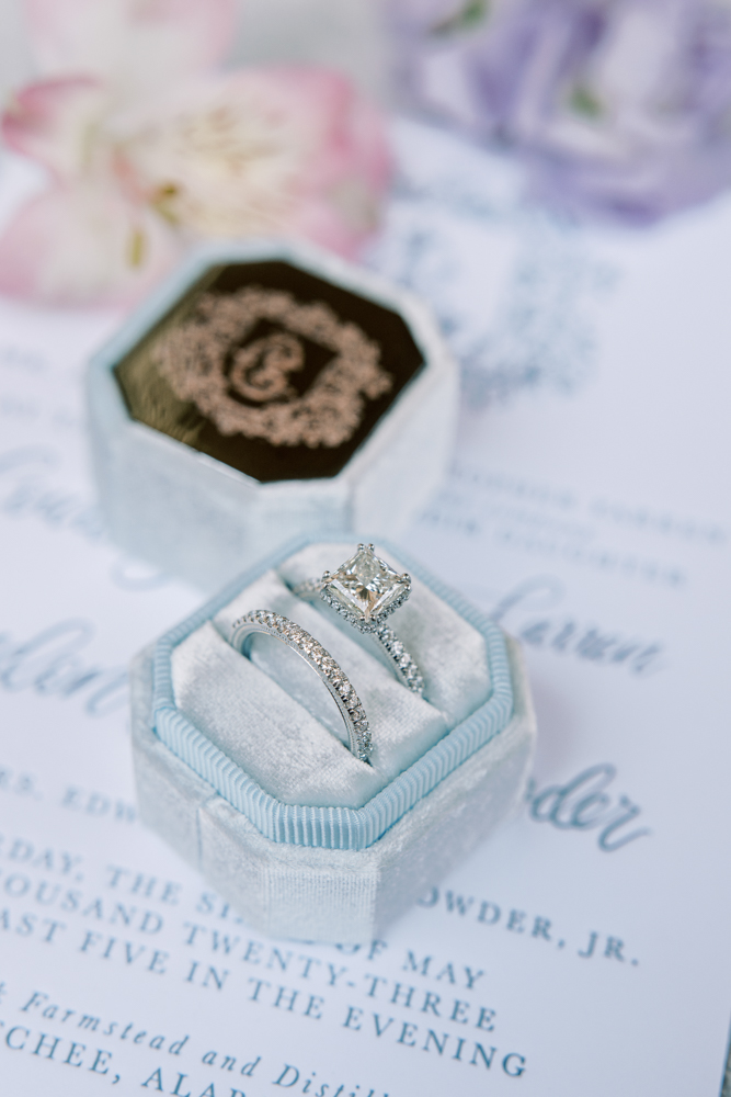 The wedding rings are placed in a blue velvet ring box for the Southern wedding.