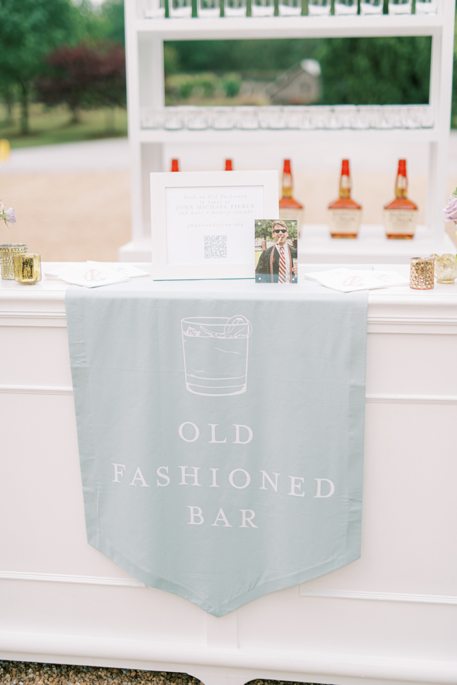 The wedding reception at Otter Creek Farmstead includes an Old Fashioned bar for the groom.