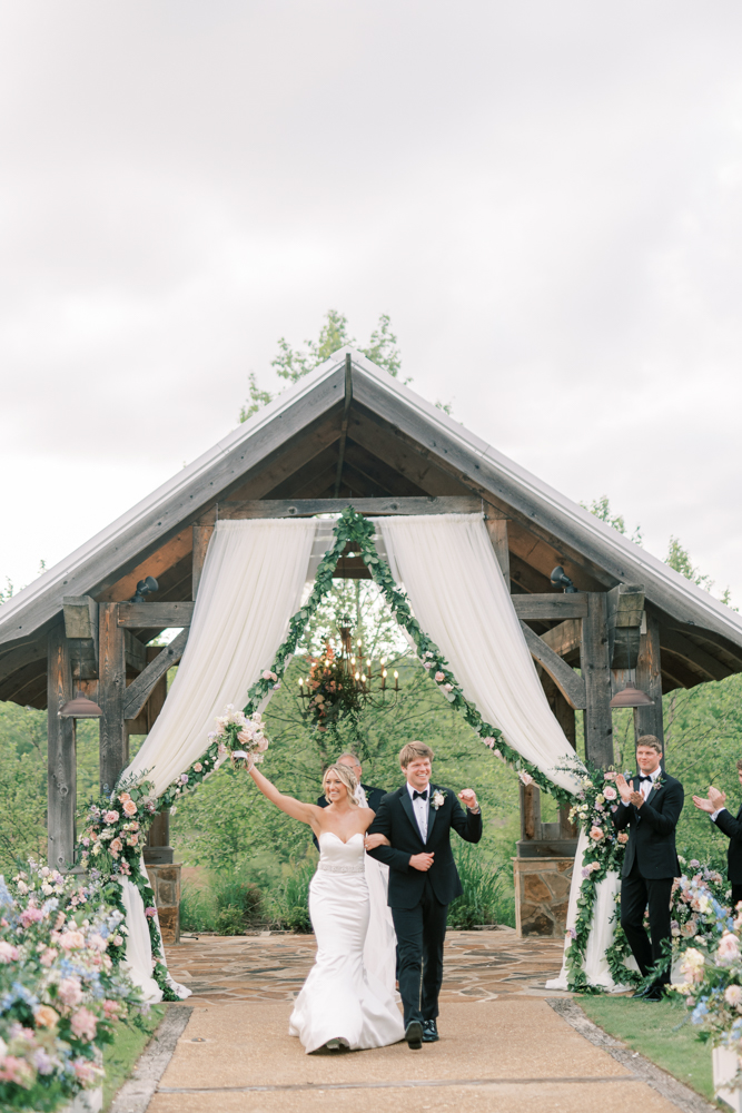 The bride and groom are married during a Southern wedding ceremony at Otter Creek Farmstead.