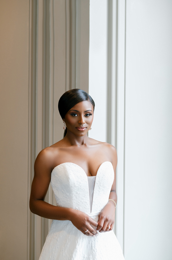 The bride stands in the ballroom of Grand Bohemian Hotel Mountain Brook.