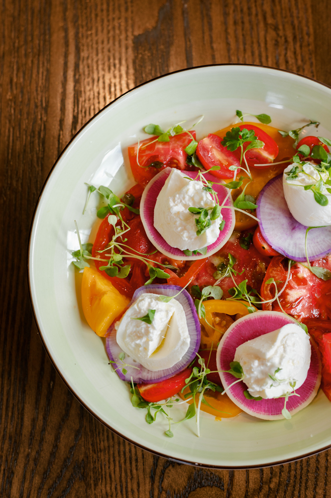 A colorful salad is plated by Grand Bohemian Hotel Mountain Brook.