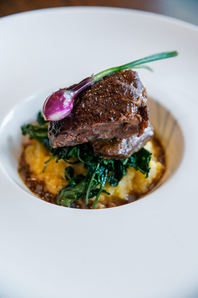 A wedding reception entree is plated by Grand Bohemian Hotel Mountain Brook.