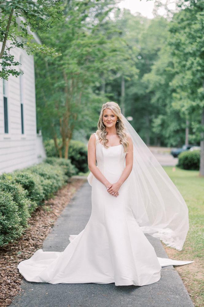 The bride is dressed in her wedding gown for her Alabama wedding ceremony.