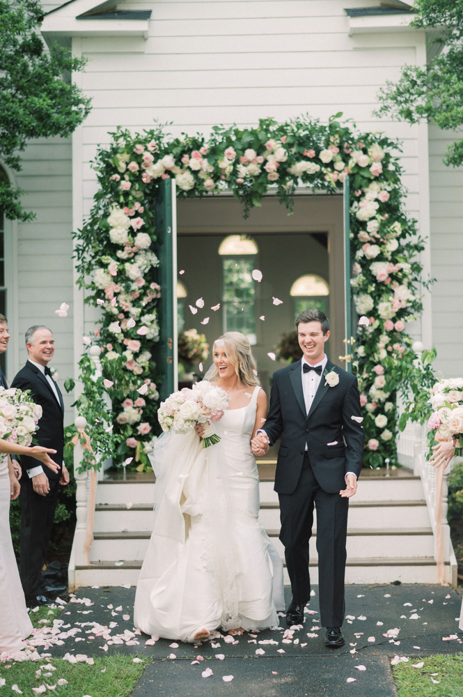 The happy couple exits the wedding chapel at Children's Harbor in Alabama.