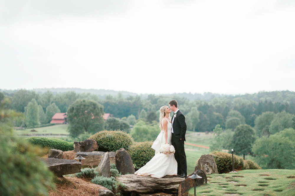 The bride and groom share a sweet moment together before their Southern wedding ceremony.