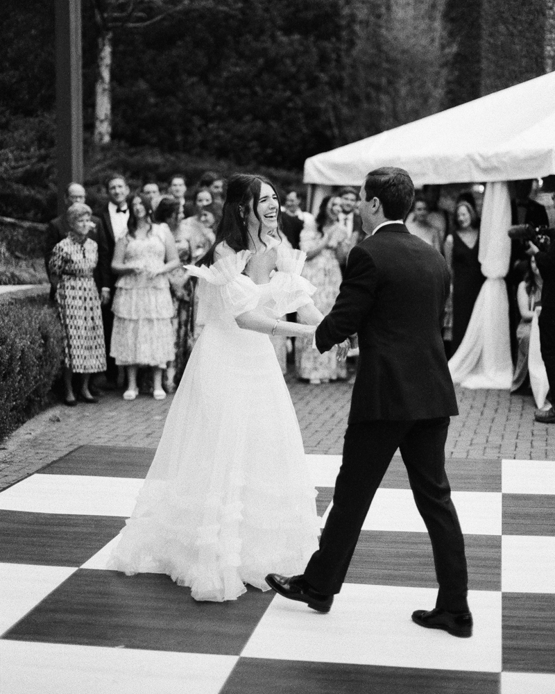 The bride and groom share a first dance during their reception at Windwood Equestrian.