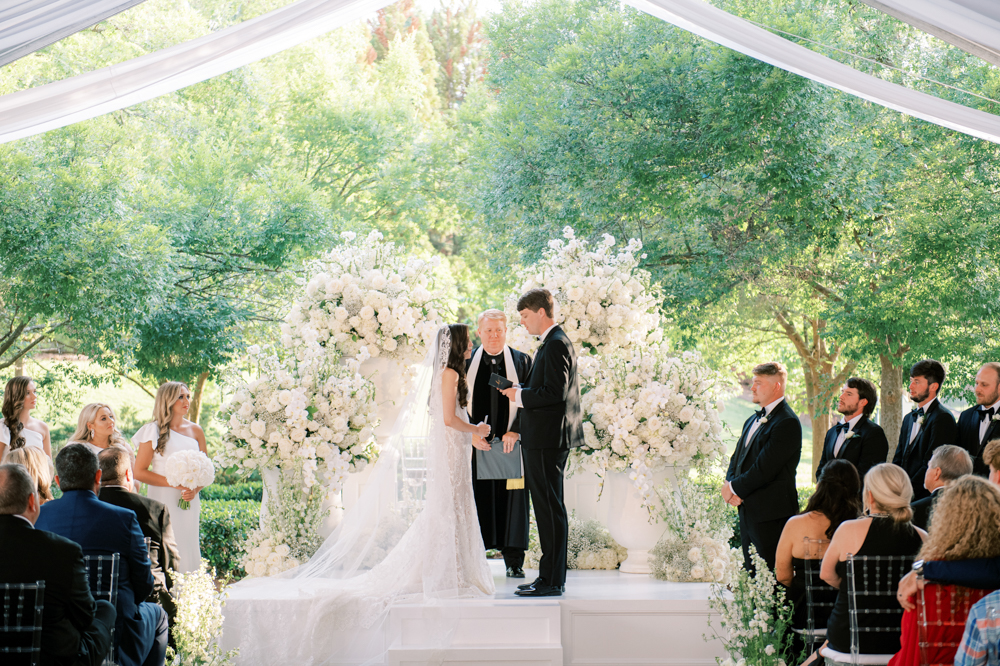 The bride and groom share their vows at their wedding ceremony at Ross Bridge Resort.