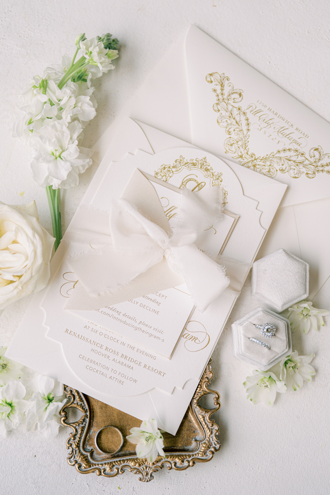 The classic wedding invitations are tied with ribbon.