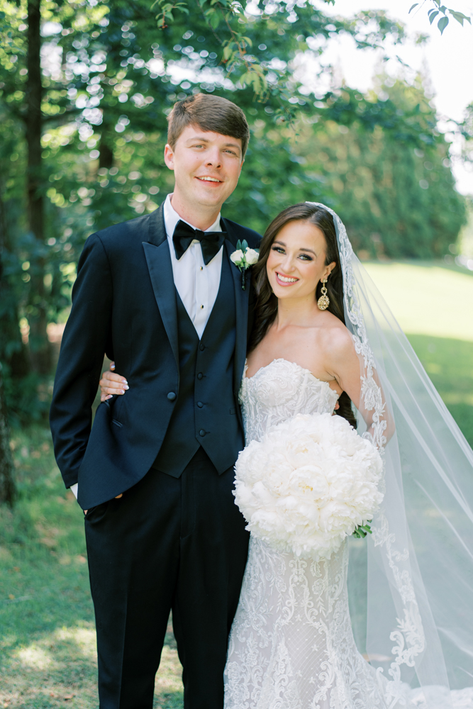 The bride and groom embrace on the day of their Alabama wedding.