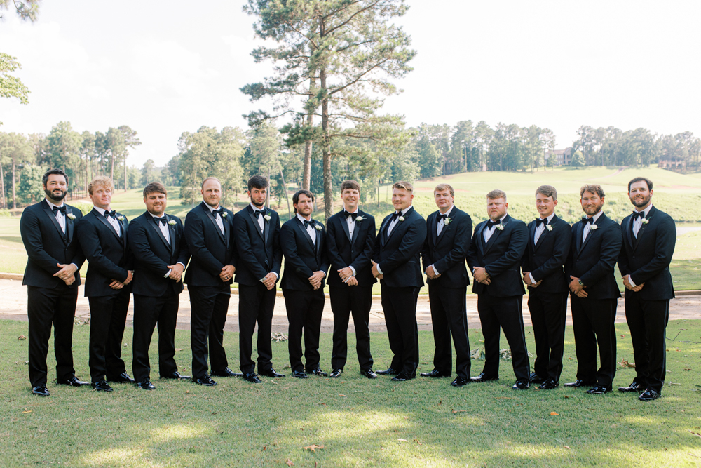 The groomsmen stand together on the golf course at Ross Bridge Resort in Birmingham, Alabama.