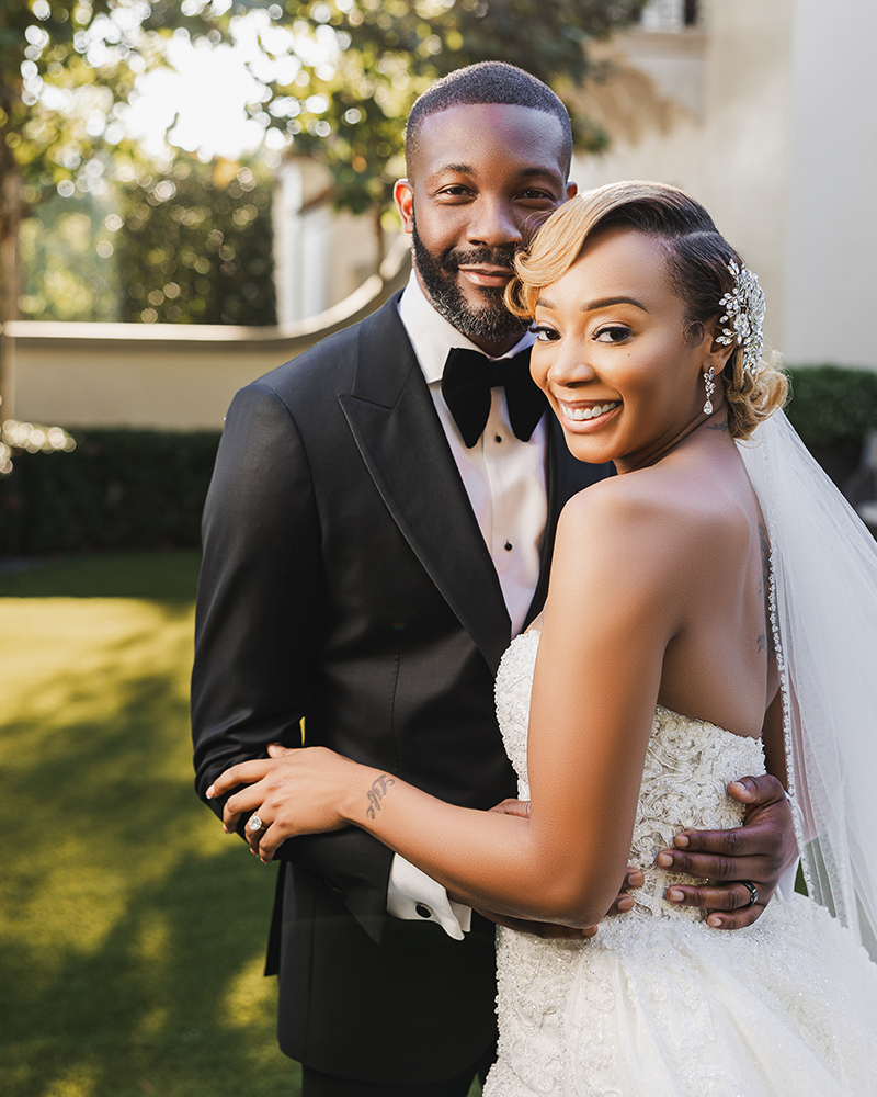 Birmingham Mayor Randall Woodfin embraces the bride before the wedding day in Alabama.