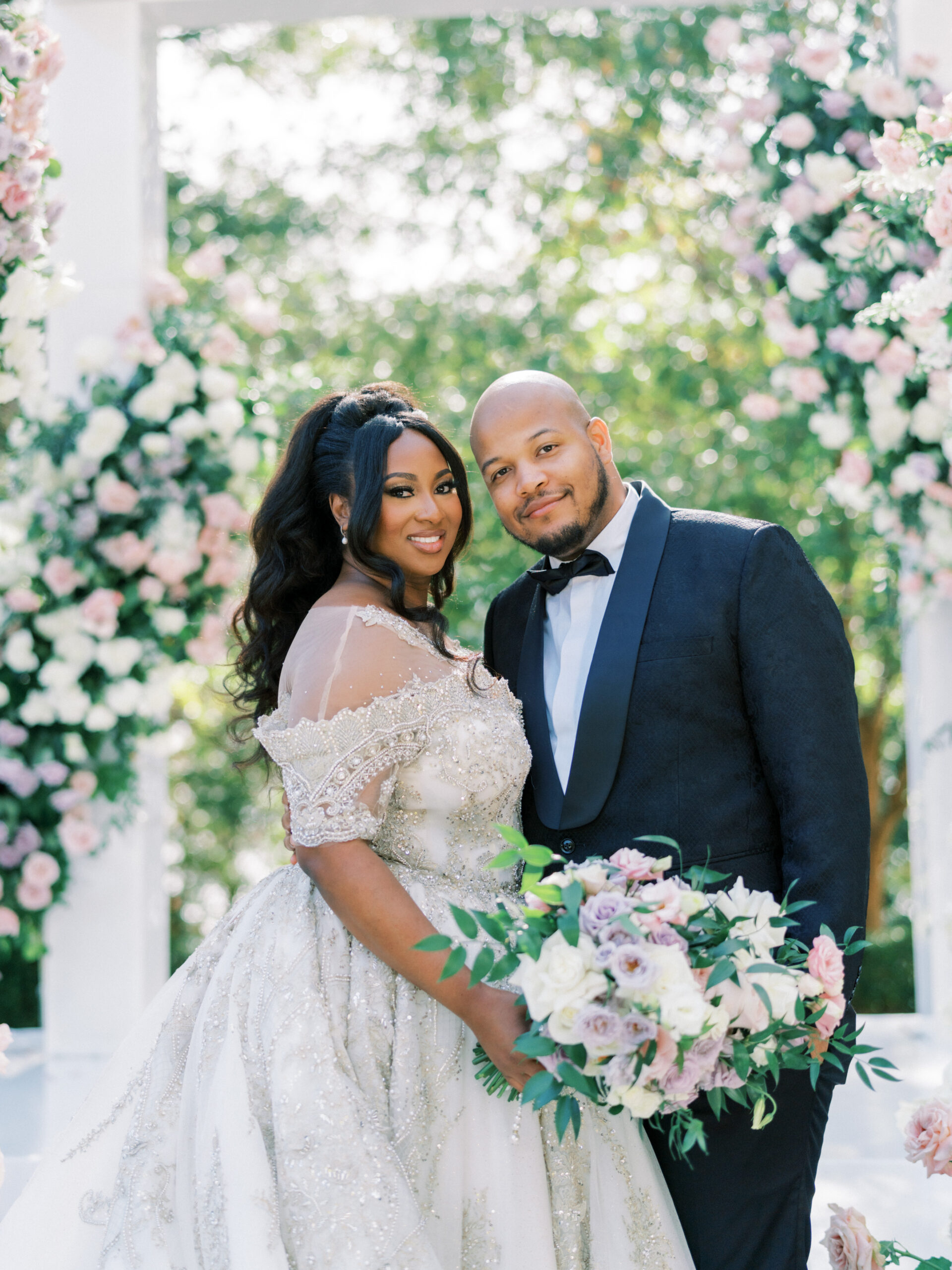 The bride and groom stand together at their wedding ceremony in Tuscaloosa, Alabama.