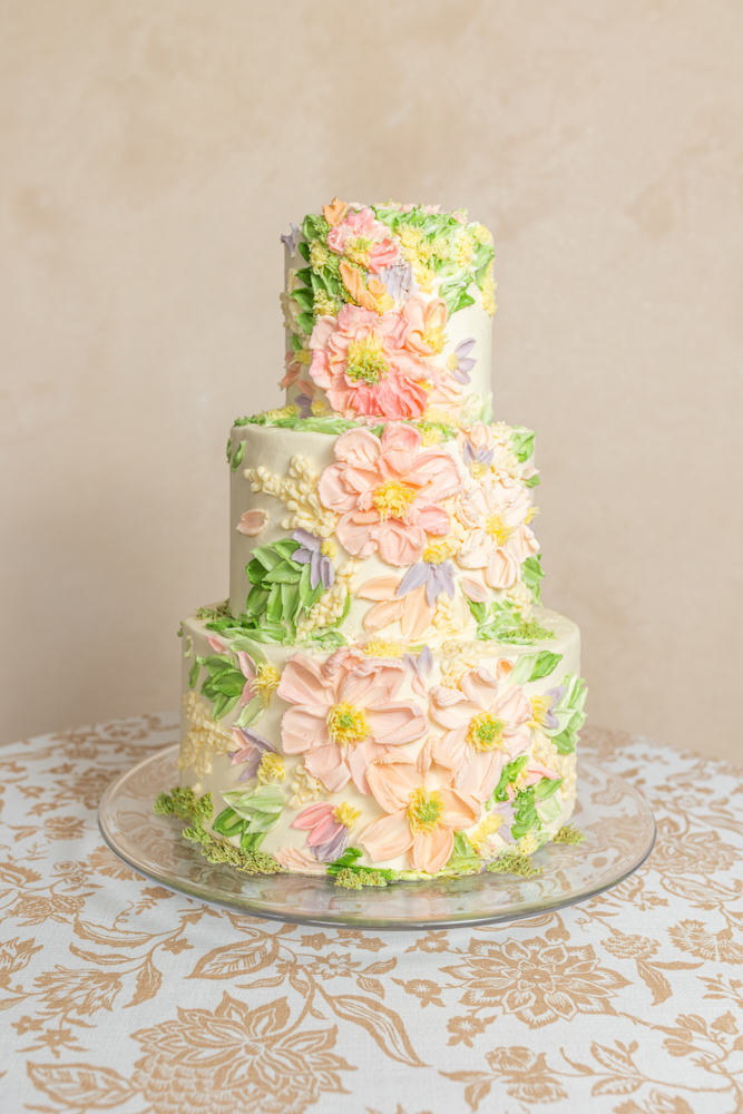 A wedding cake from Olexa's Cafe in Alabama is decorated with buttercream flowers.