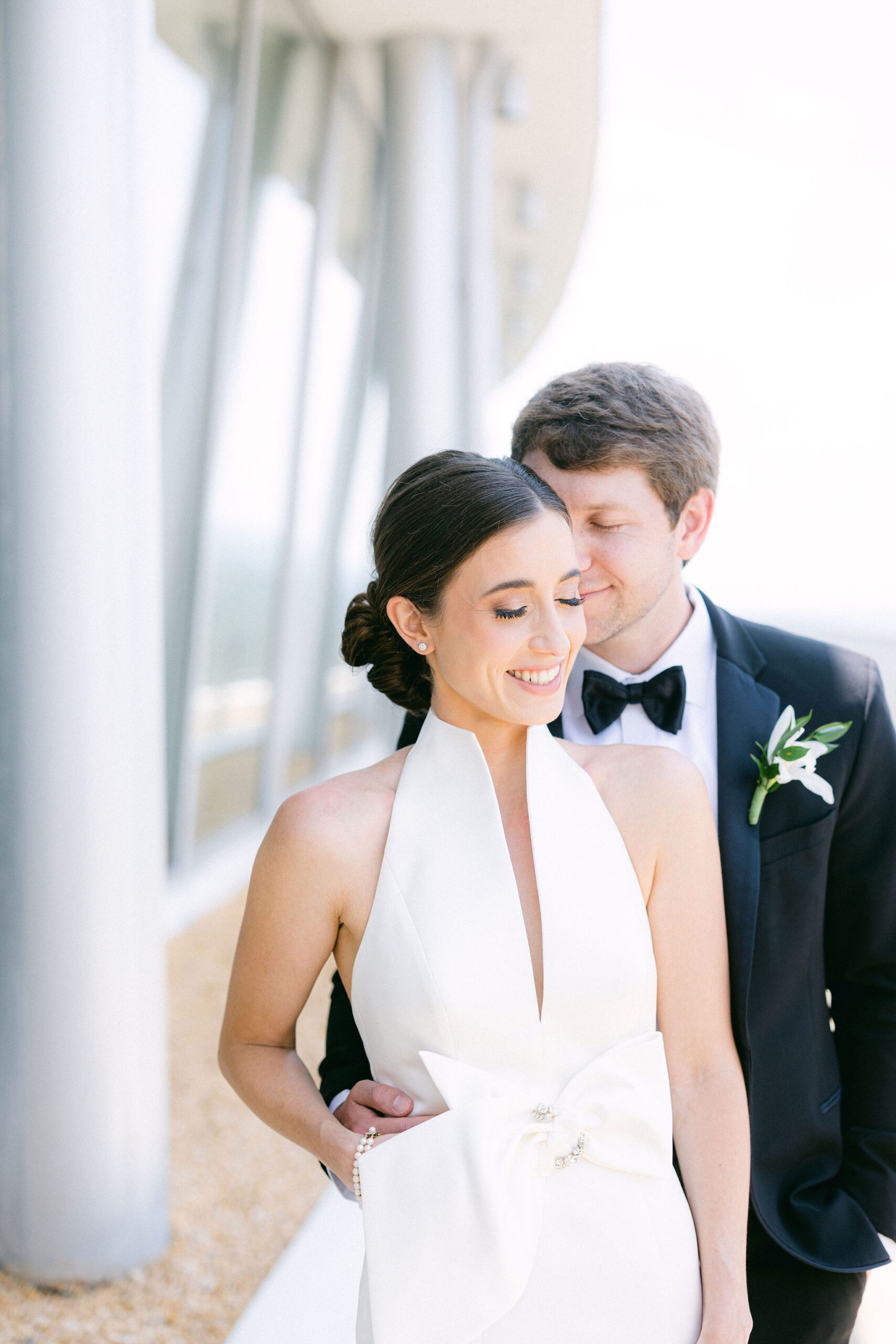 The bride and groom embrace before the wedding ceremony in Alabama.