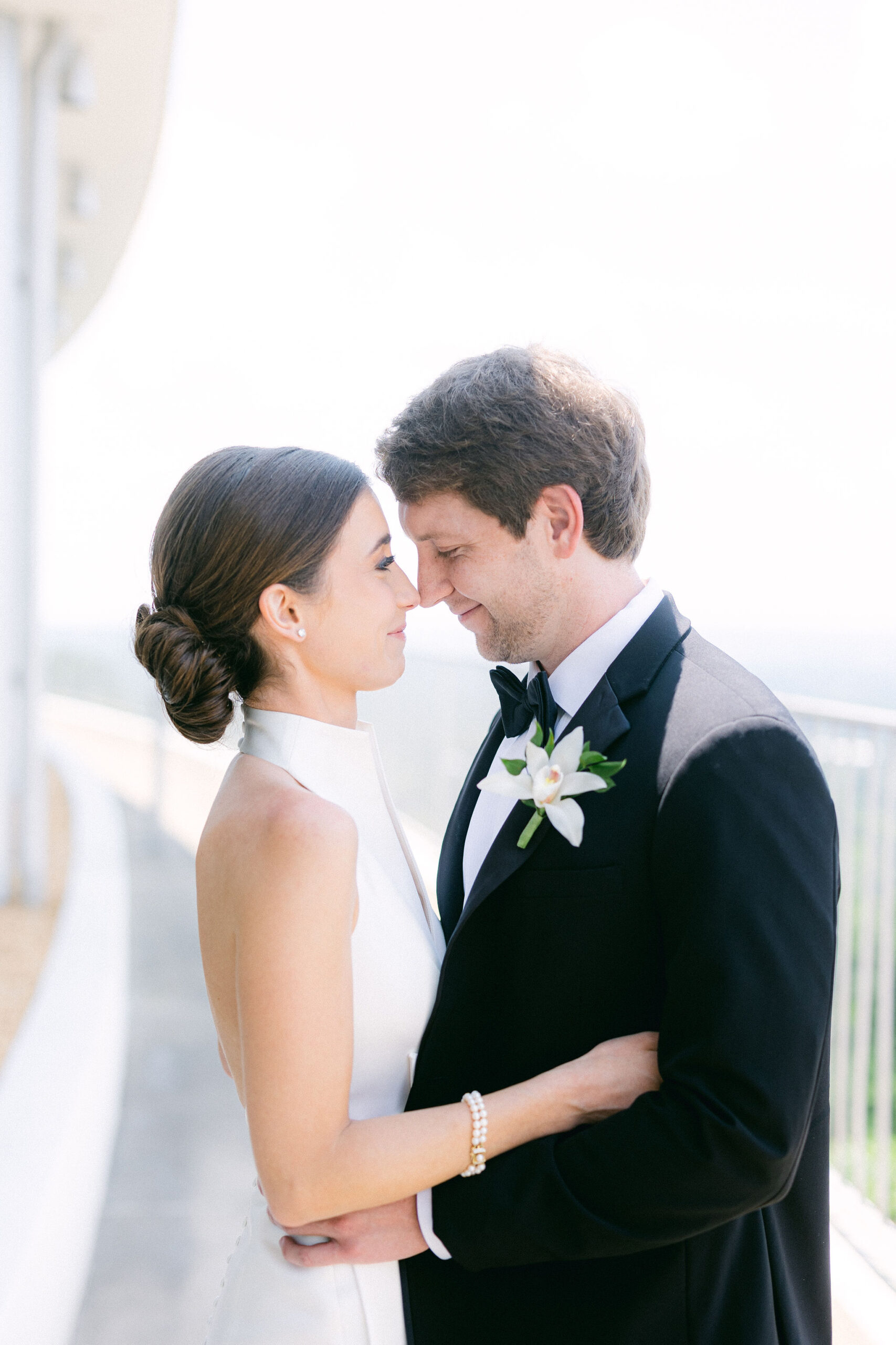 The bride and groom smile at each other before their Alabama wedding ceremony.