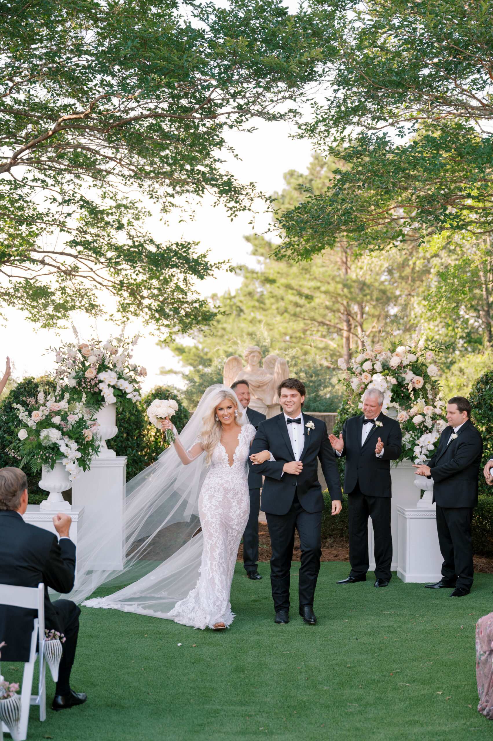 The bride and groom exit their wedding ceremony together.