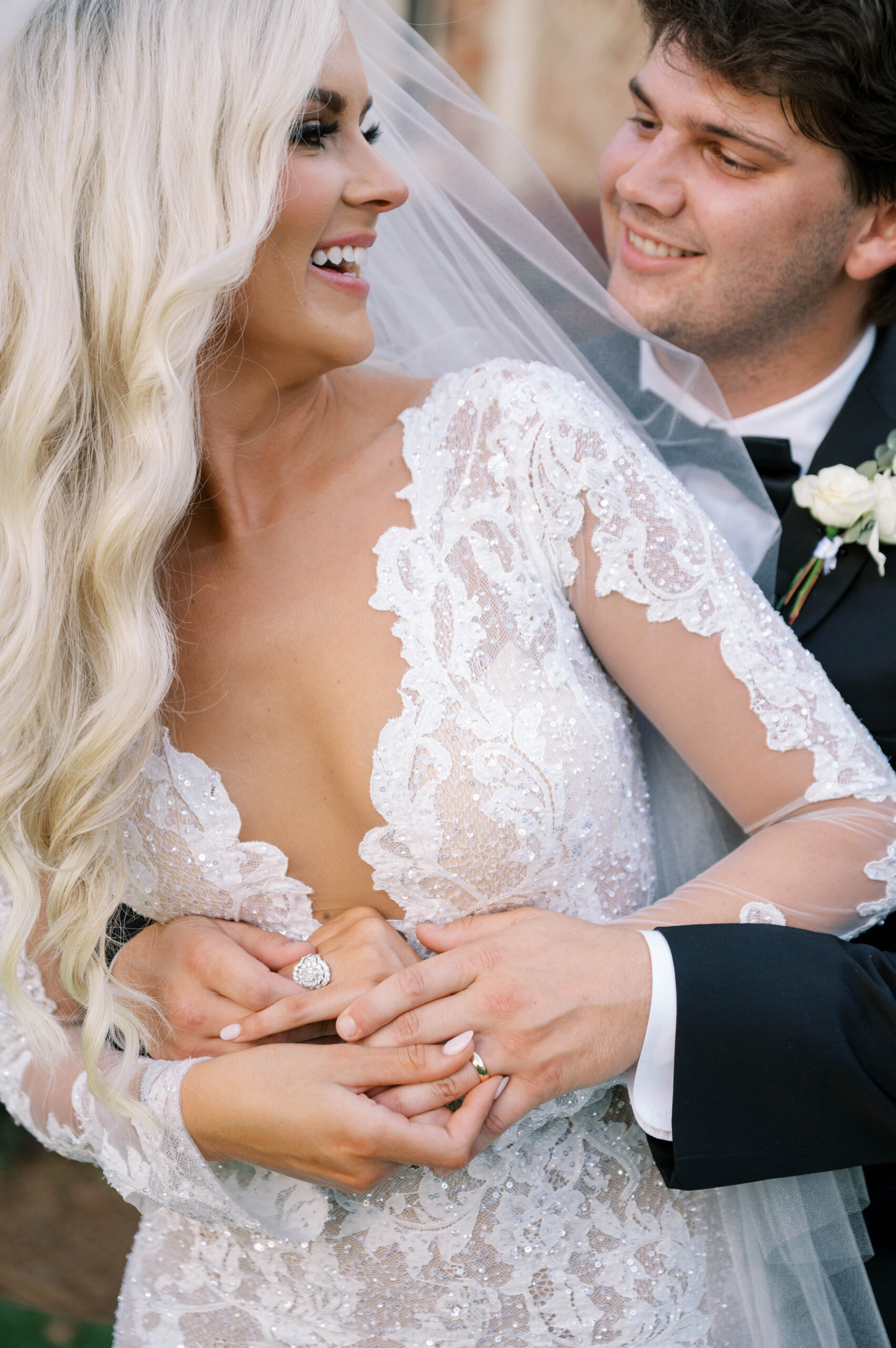 The bride and groom embrace before their Southern wedding.