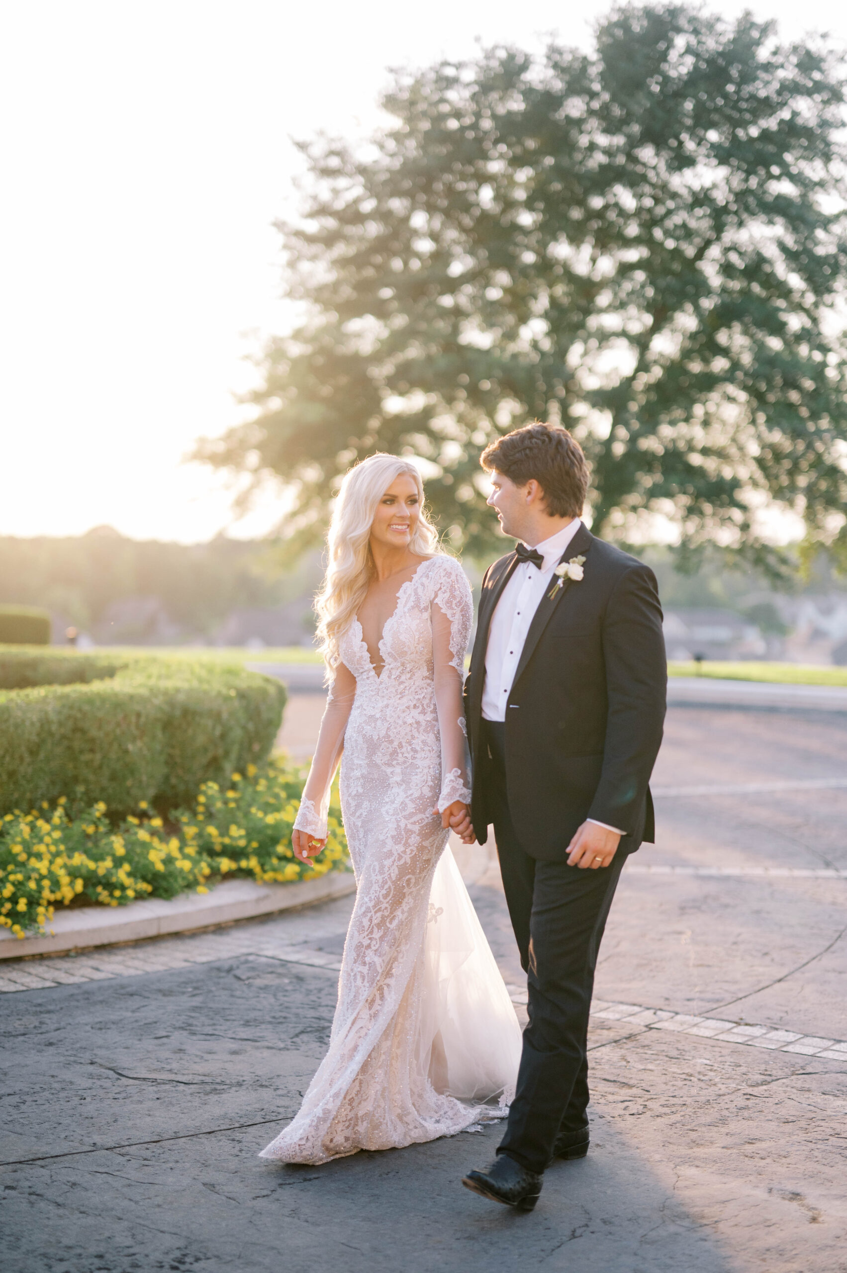 The bride and groom walk together before their Southern wedding.