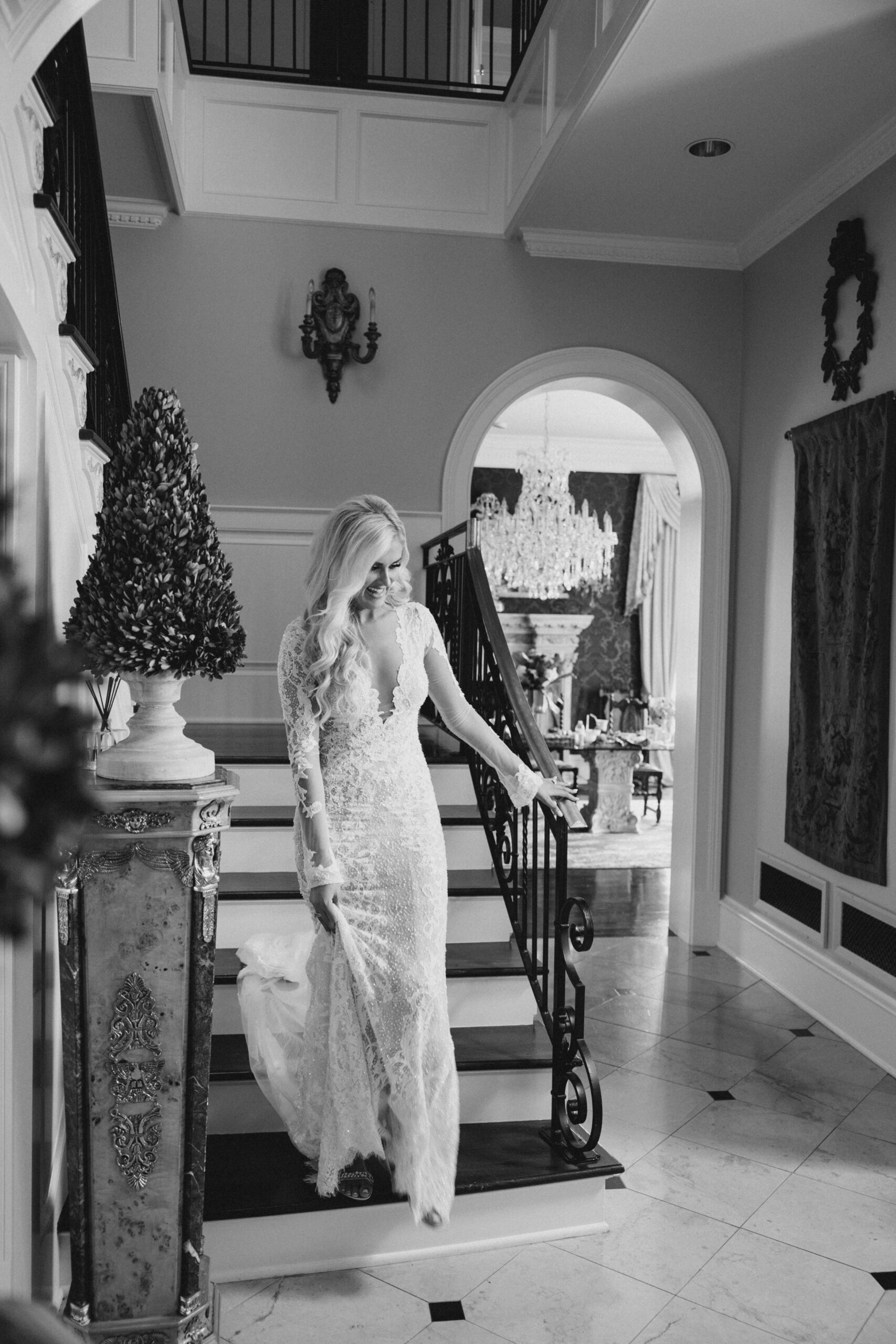 The bride walks down the stairs before her Southern wedding day.