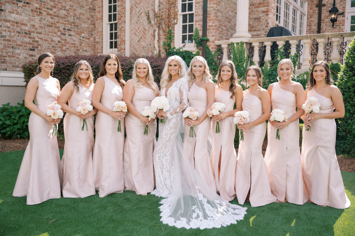 The bridal party stands together before the wedding.