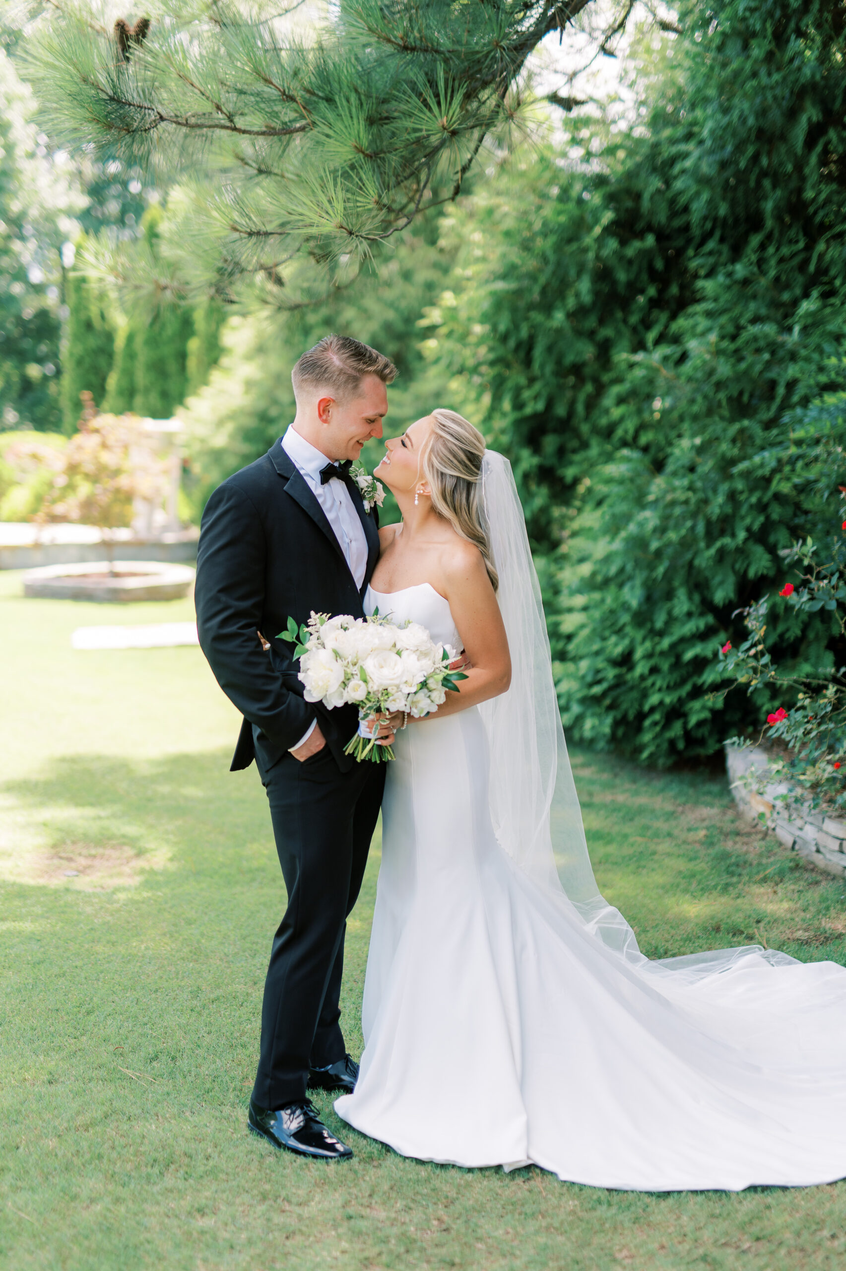 The bride and groom smile at each other at their Alabama wedding.