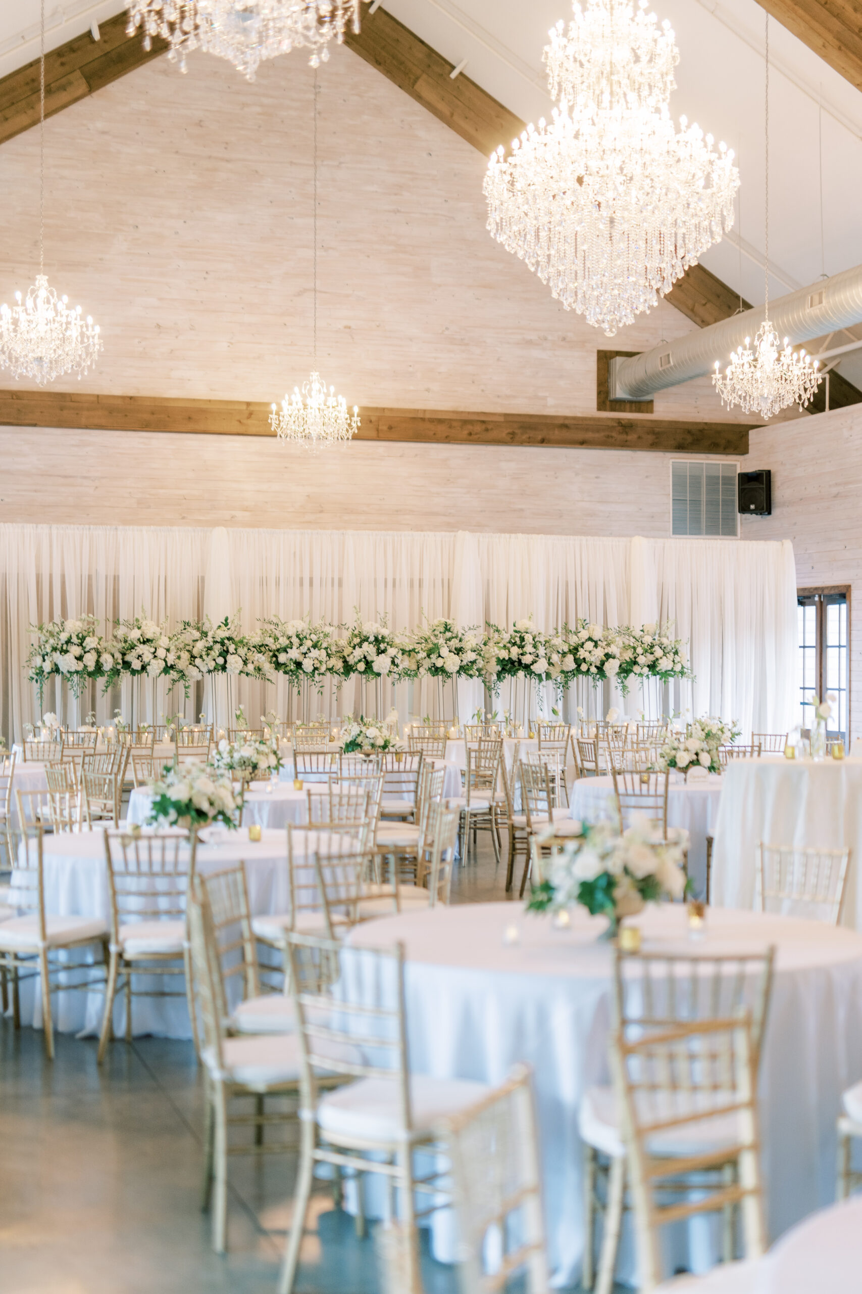 Park Crest Event Facility is decorated in white flowers for a Southern wedding.