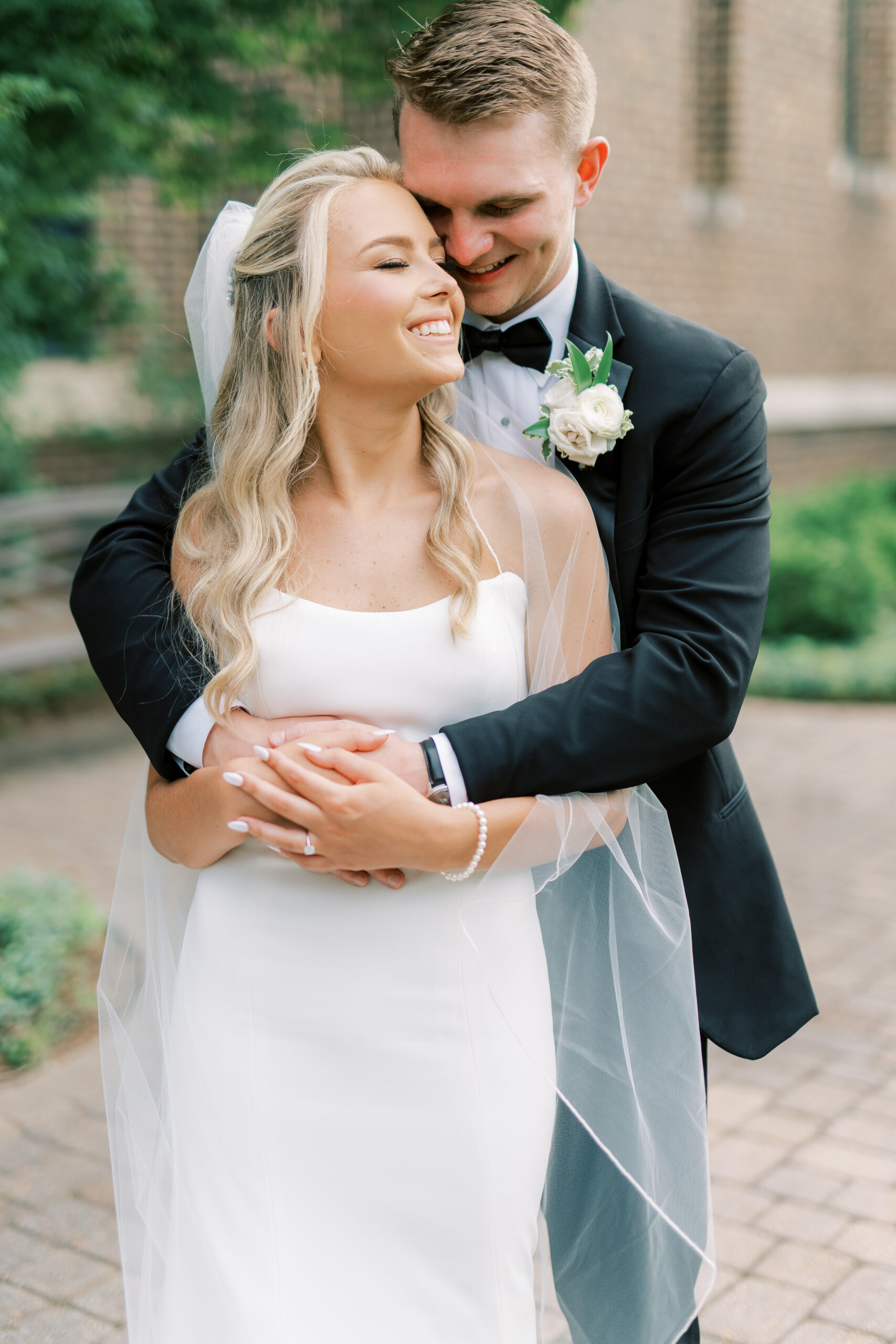 The bride and groom embrace before their Alabama wedding day.