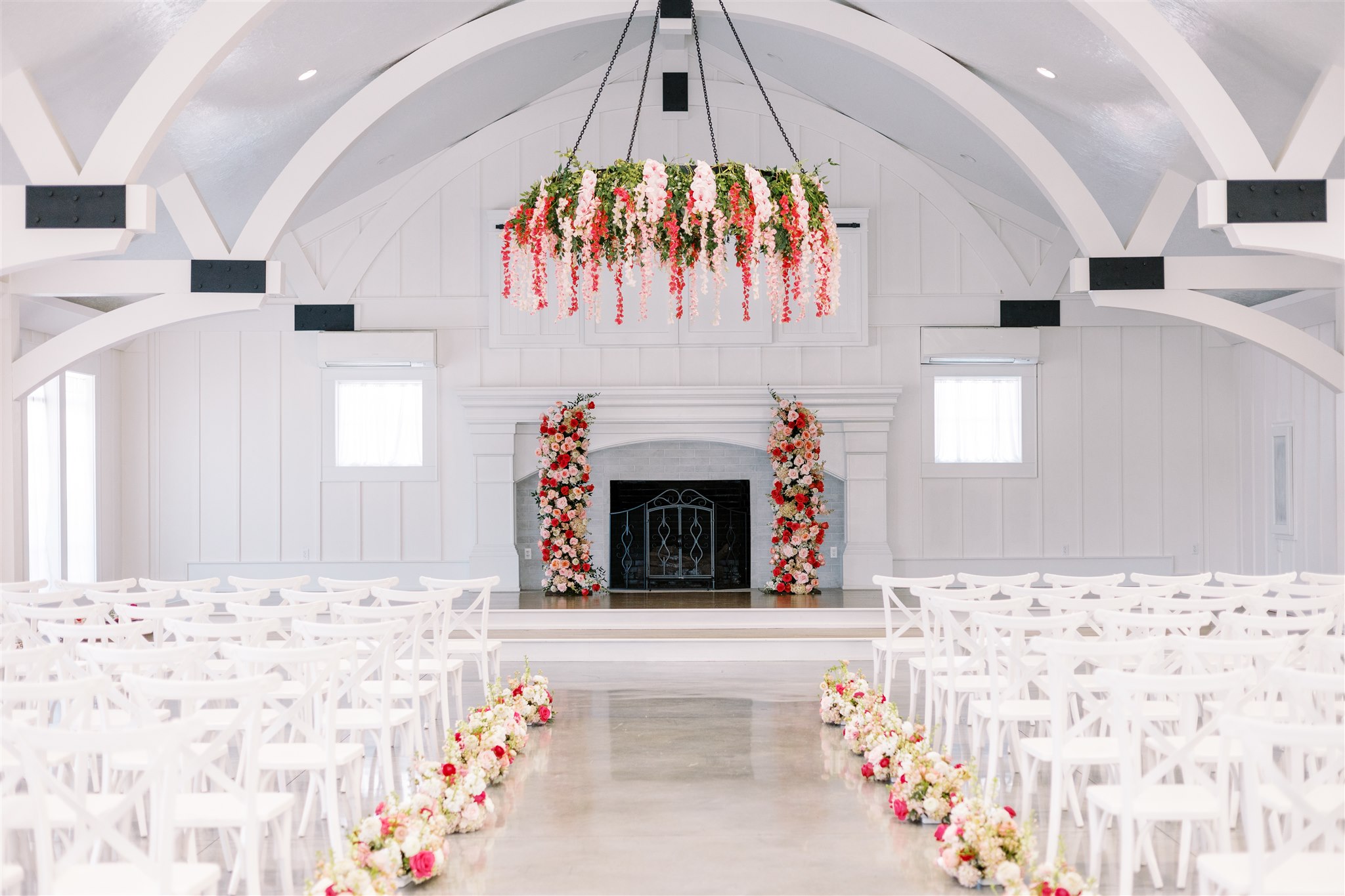 Oak Meadow Event Center is decorated with pink flowers for a Southern wedding in Alabama.