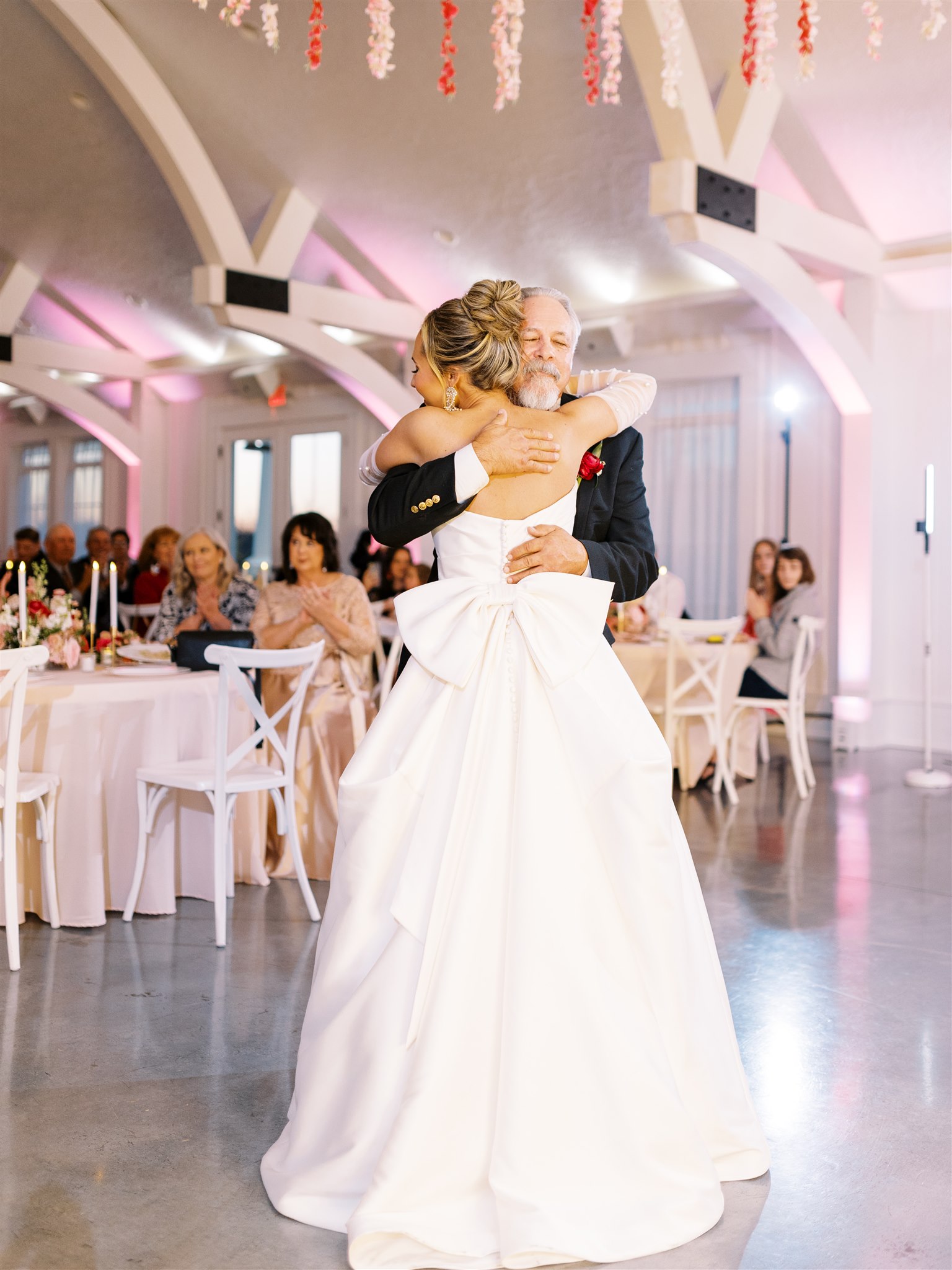 The bride and her father embrace at Oak Meadow Event Center in Ohatchee.