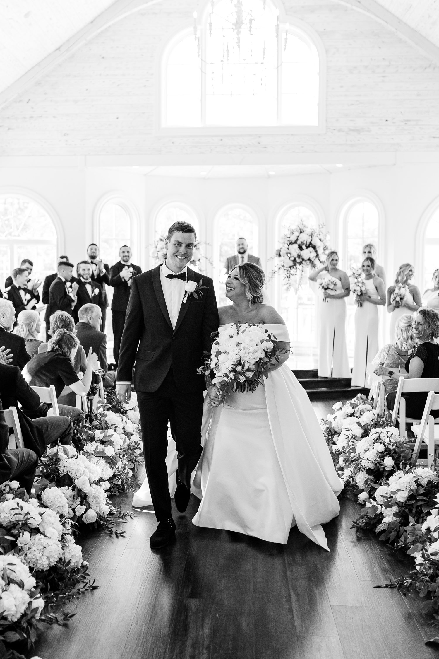 The bride and groom exit the wedding ceremony in Florence, Alabama.