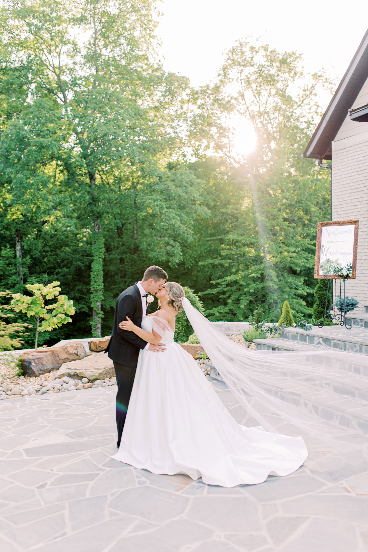 The bride and groom kiss on their wedding day in Alabama.