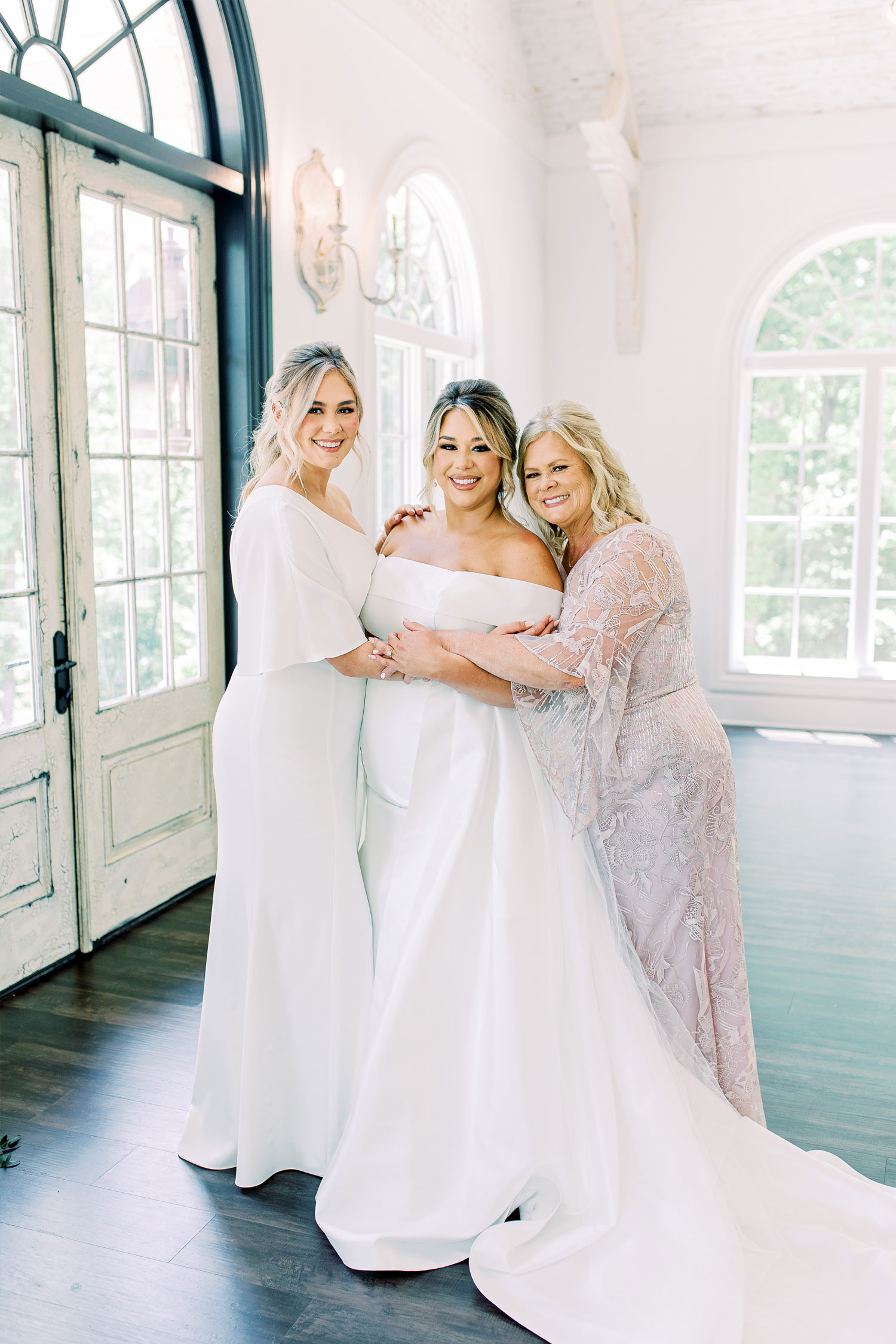 The family embraces before the bride gets married in Florence, Alabama.